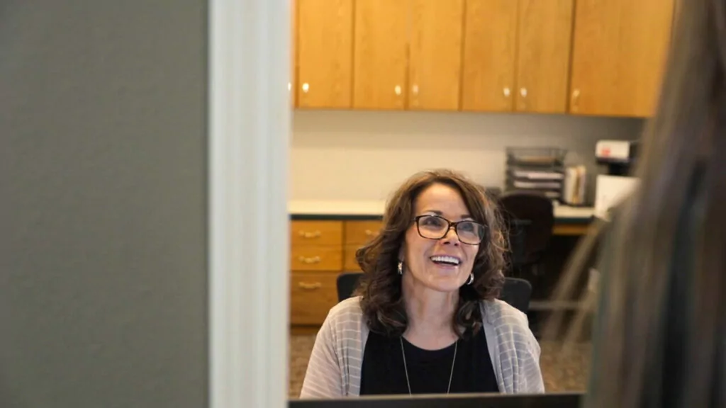 receptionist looking at patient