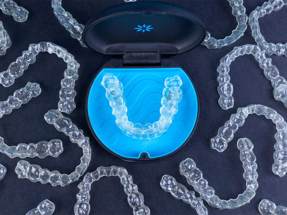 Invisalign Clear Aligners on Dark Backdrop